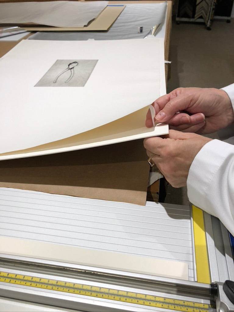 Print being float hinged to museum rag matboard