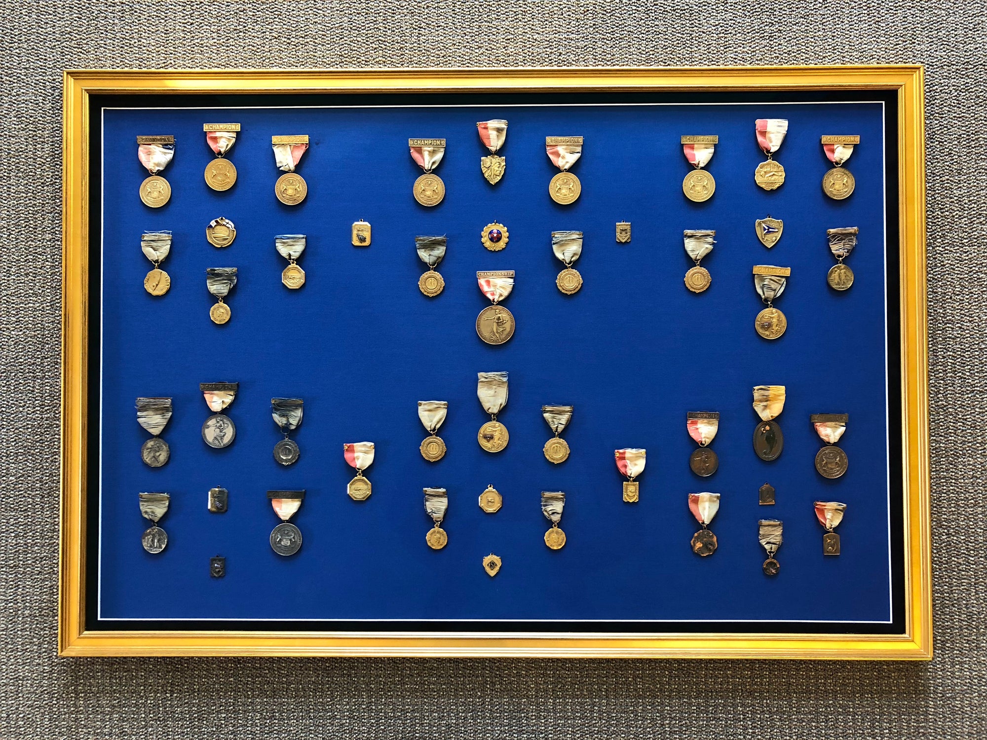 Framed swimming medals at Connecticut College